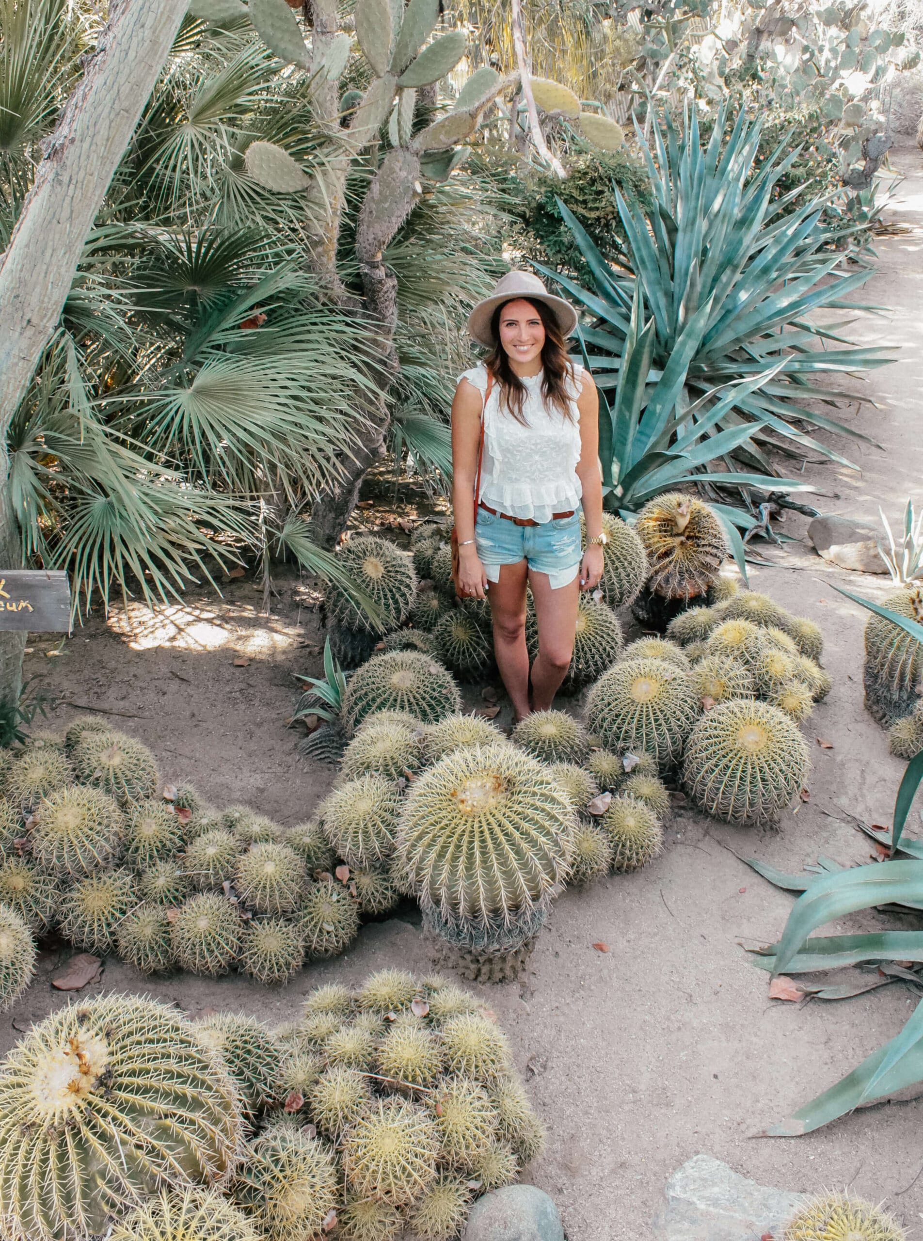 A girl stands at Moorten Botanical Garden in palm springs