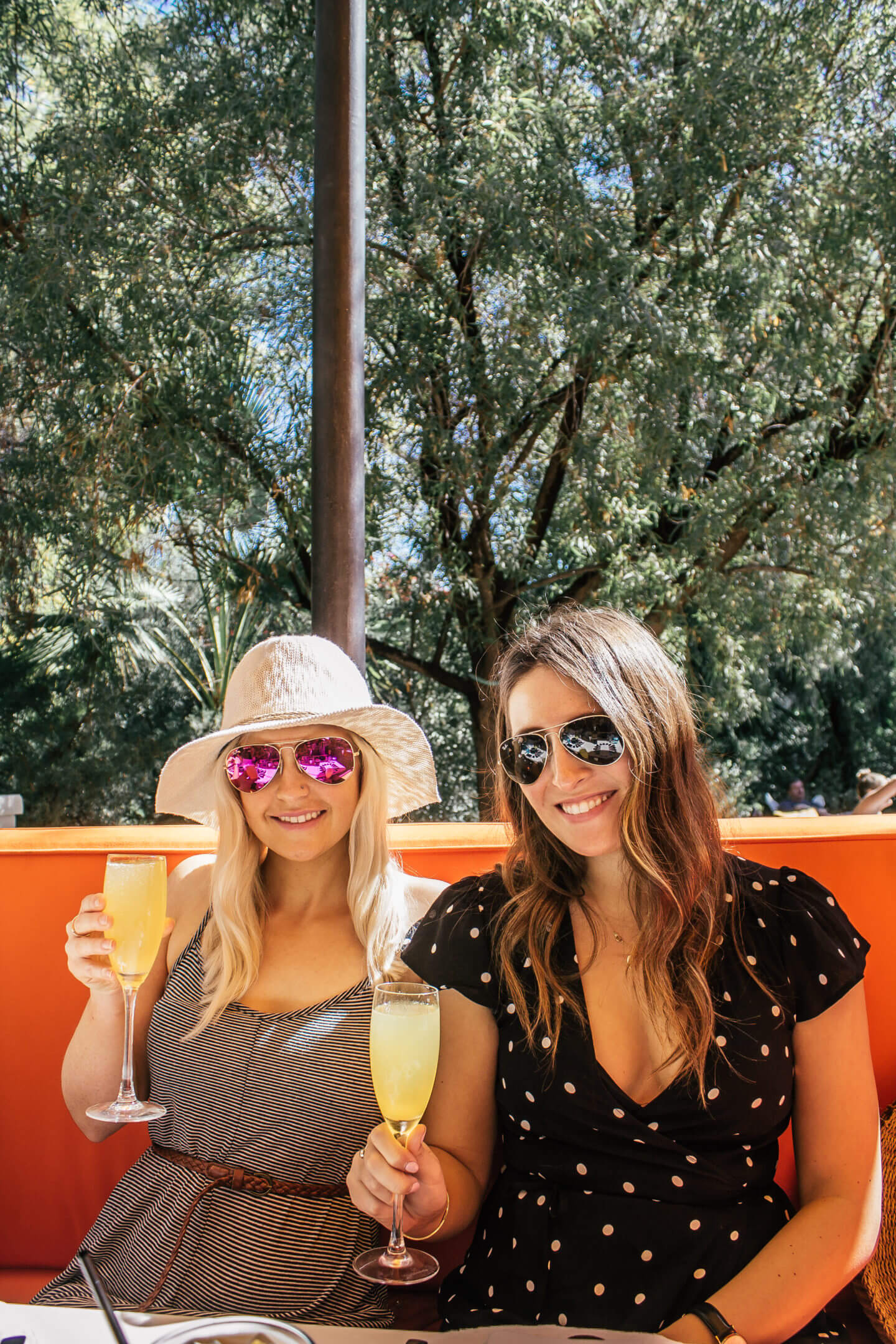 Two ladies enjoying mimosas at during brunch at Norma's at the Parker Hotel in Palm Springs