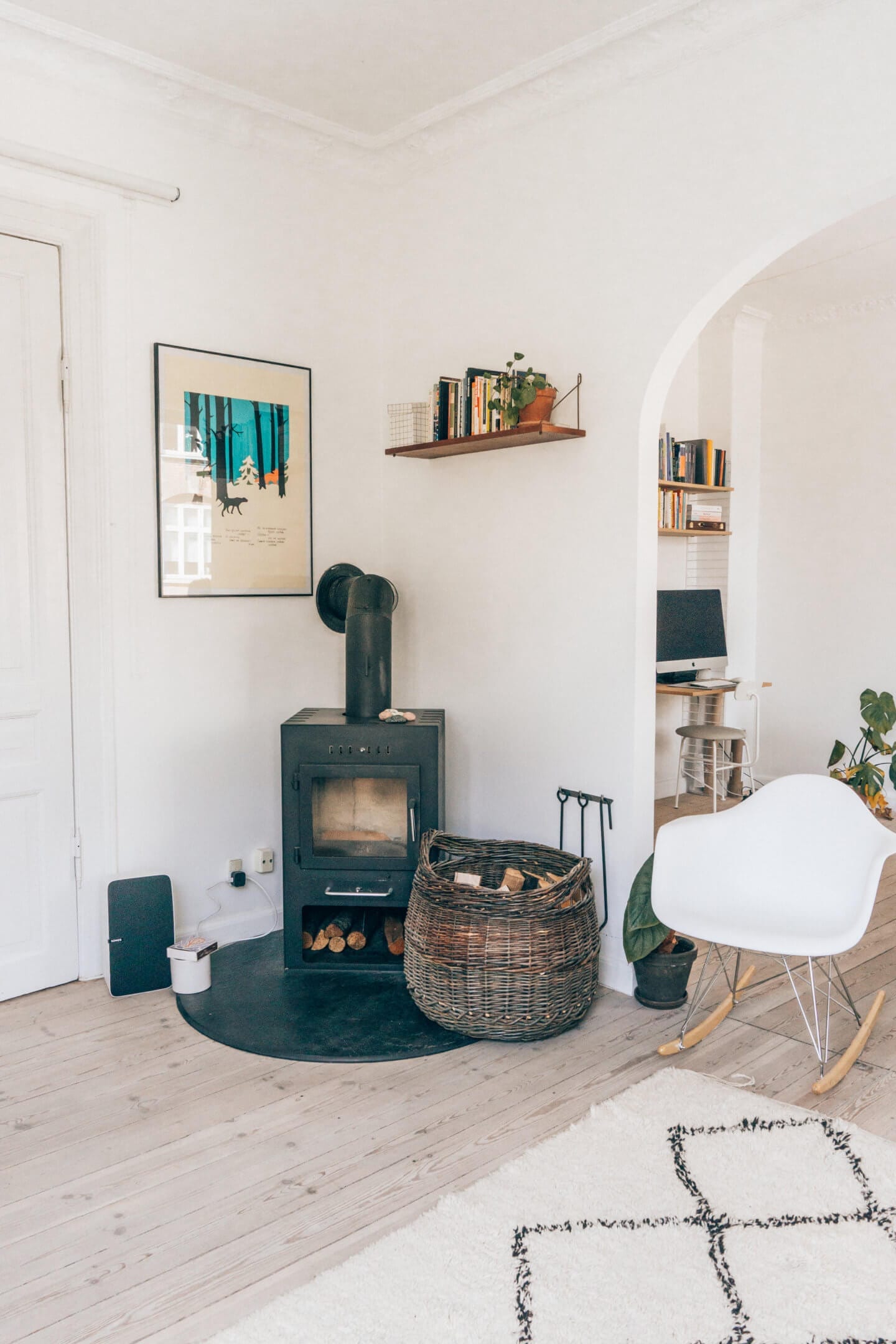 The fireplace and chair in the living room of our Copenhagen Airbnb