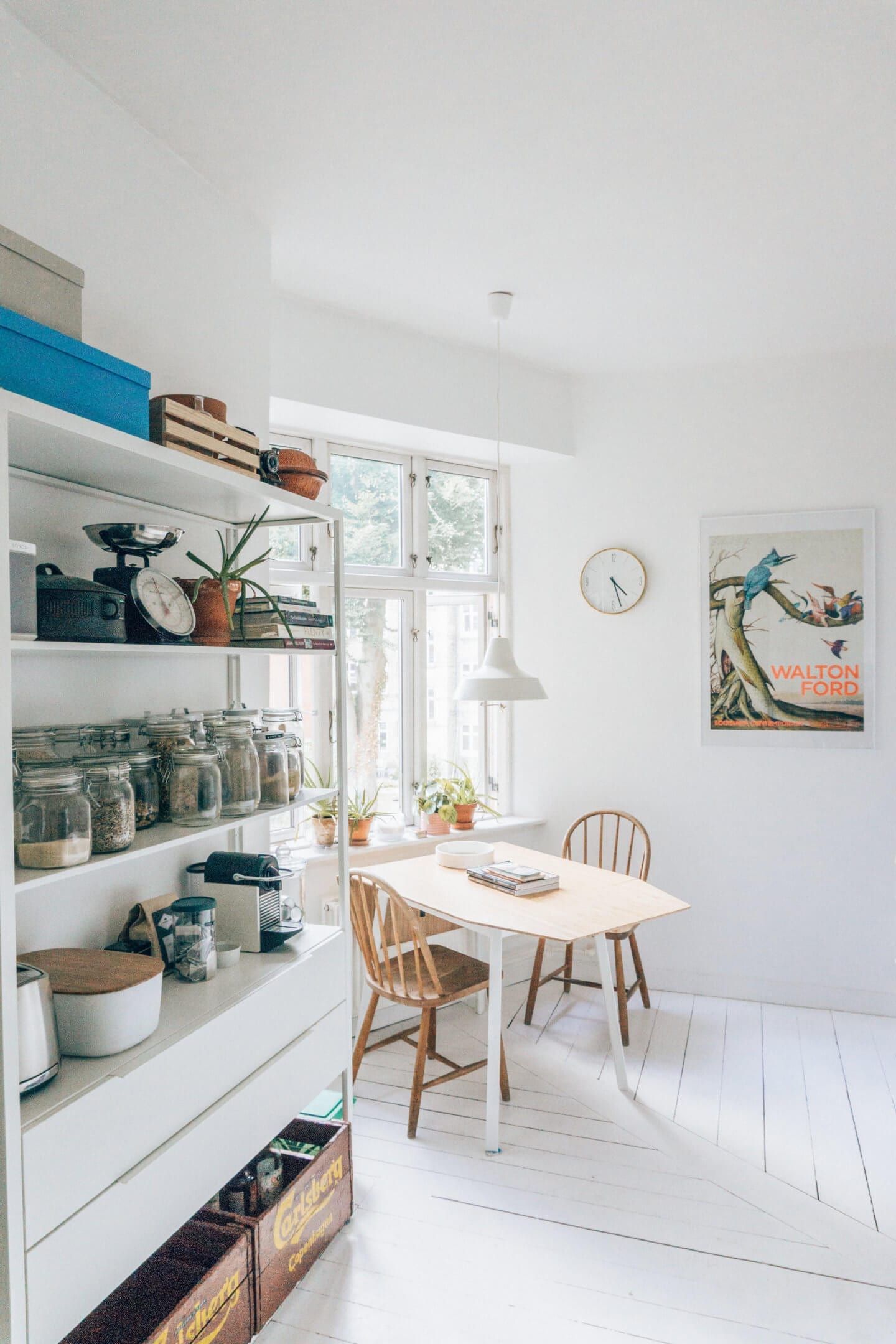 The kitchen table and pantry of our Copenhagen Airbnb