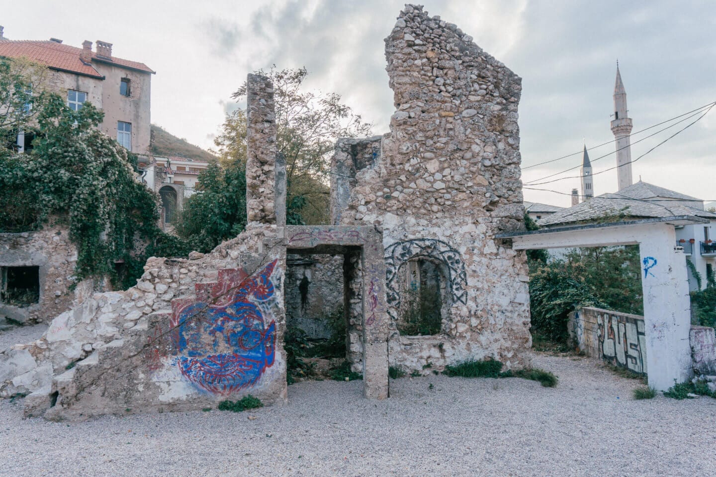 Broken down war buildings with graffiti in Mostar