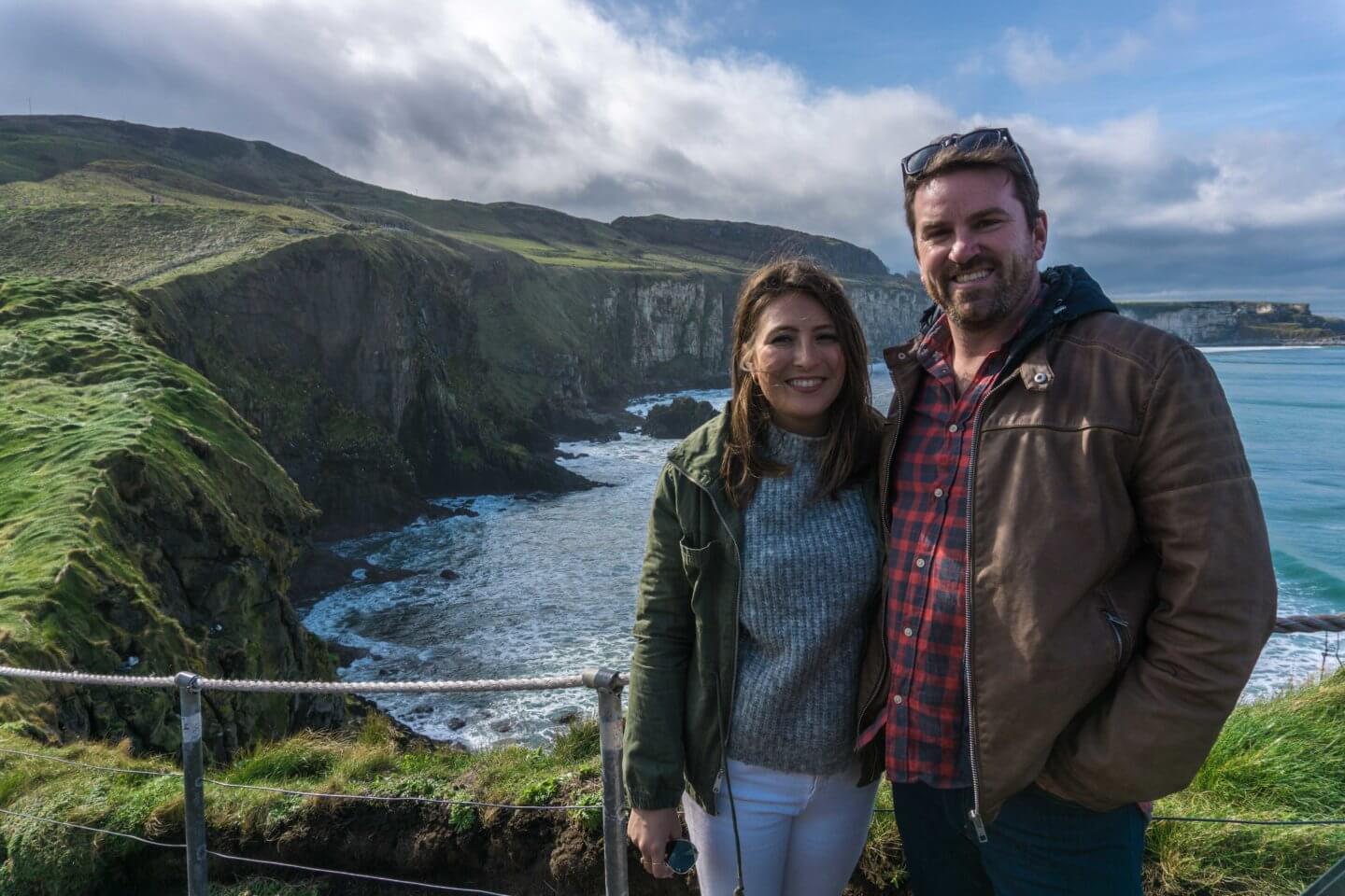 A couple in the National Trust Carrick-a-Rede Rope Bridge Park