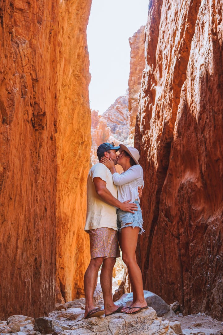 A couple kissing in the middle of Sandley Chasm in West Macdonnell Ranges