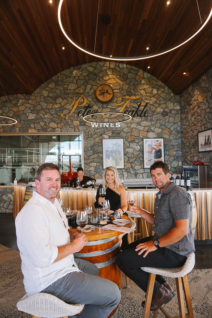 Three people at Peter Teakle winery in Port Lincoln doing a wine tasting