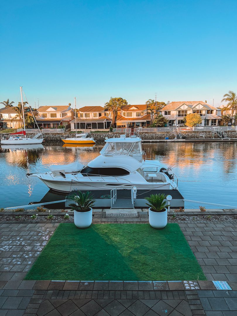 White yatch boat in Port Lincoln marina at sunset