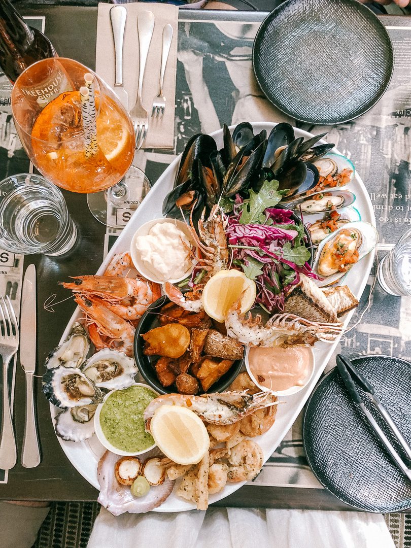 Looking down at an Aperol Spritz and a seafood platter at The Jonsons Restaurant in Byron Bay