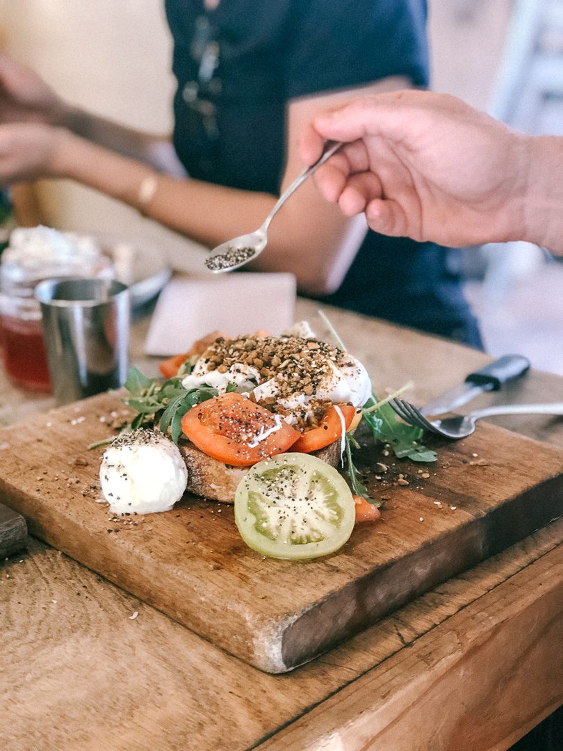 A breakfast plate of eggs, tomatoes and sourdough at Bayleaf cafe in Byron Bay