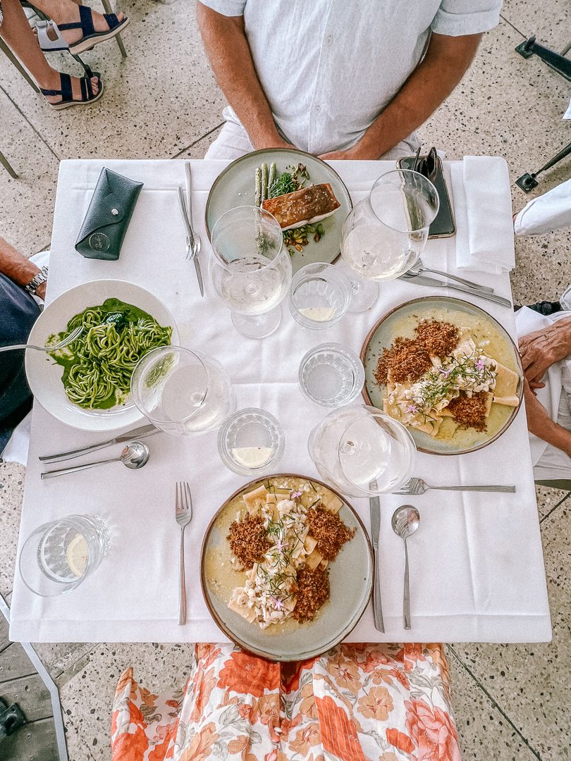 Looking down at a tablescape and four plates at The Beach restaurant in Byron Bay