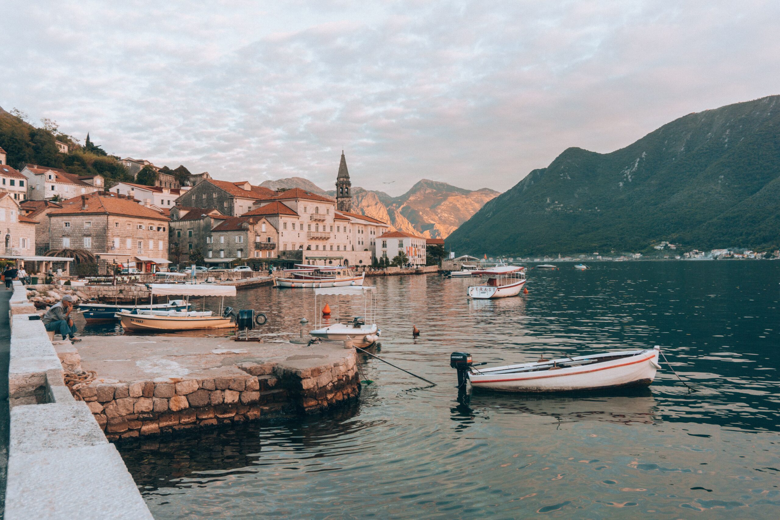 Best Places for Digital Normads: beautiful old town of Persat Montenegro with the golden glow of sunset
