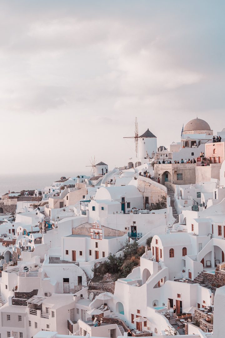 During 10 Days in Greece Itinerary be sure to visit the iconic Greek Island of Santorini and watch the sunset at Oia