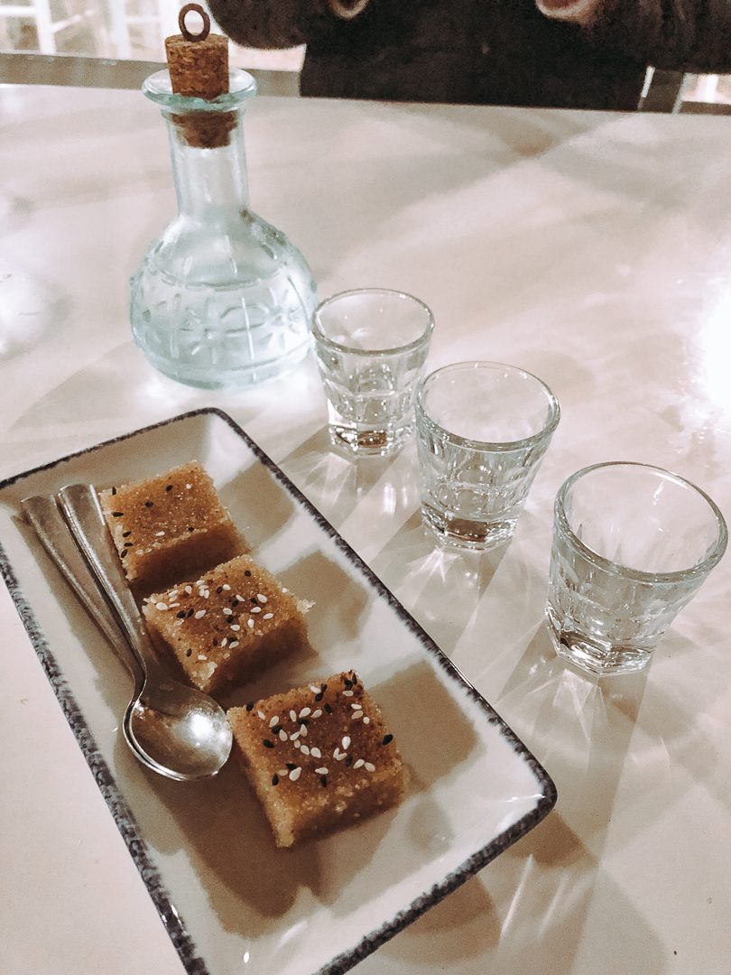 Traditional Greek dessert and complementary Raki is served at restaurants in Crete, Greece.