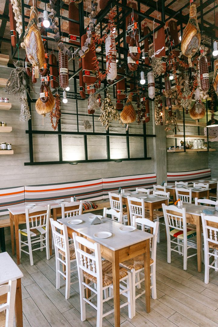 A unique butcher shop and restaurant  with it's table and chairs in Chania, Crete in Greece.