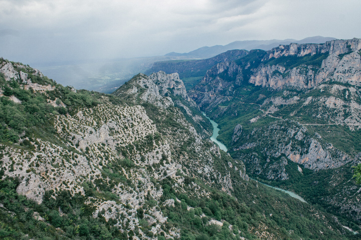 Looking down at the Gorges de Verdon and the bright turquoise river that runs through it in France