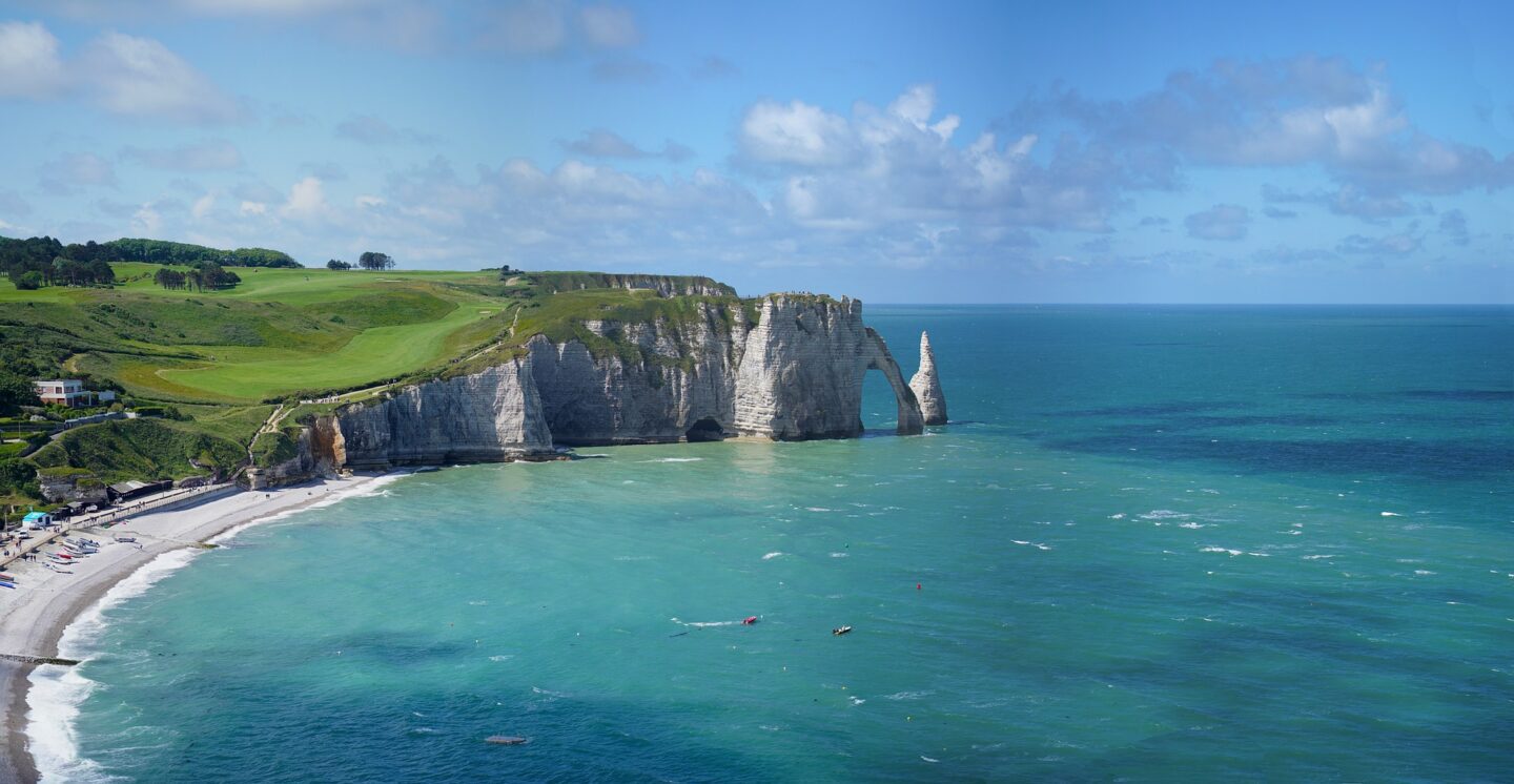 The white cliffs, sandy beaches and blue waters of Normandy, one of the top places to visit in France
