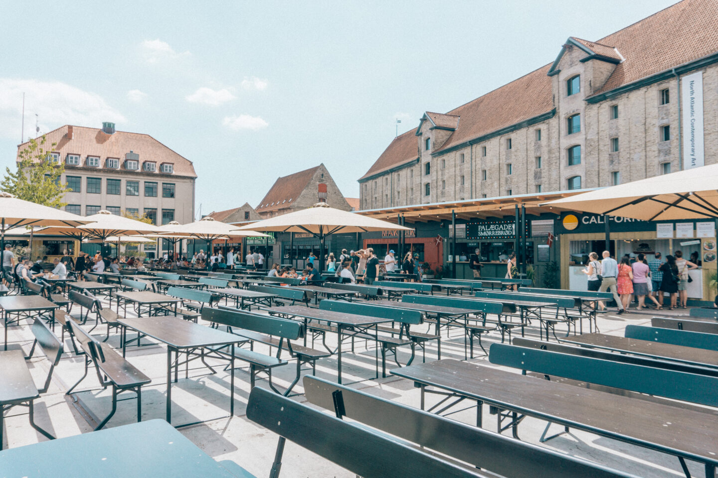 Shipping containers, picnic tables and the outdoor seating area at Bridge Street Kitchen (Broens Gadekøkken) in Copenhagen - a top thing to do!