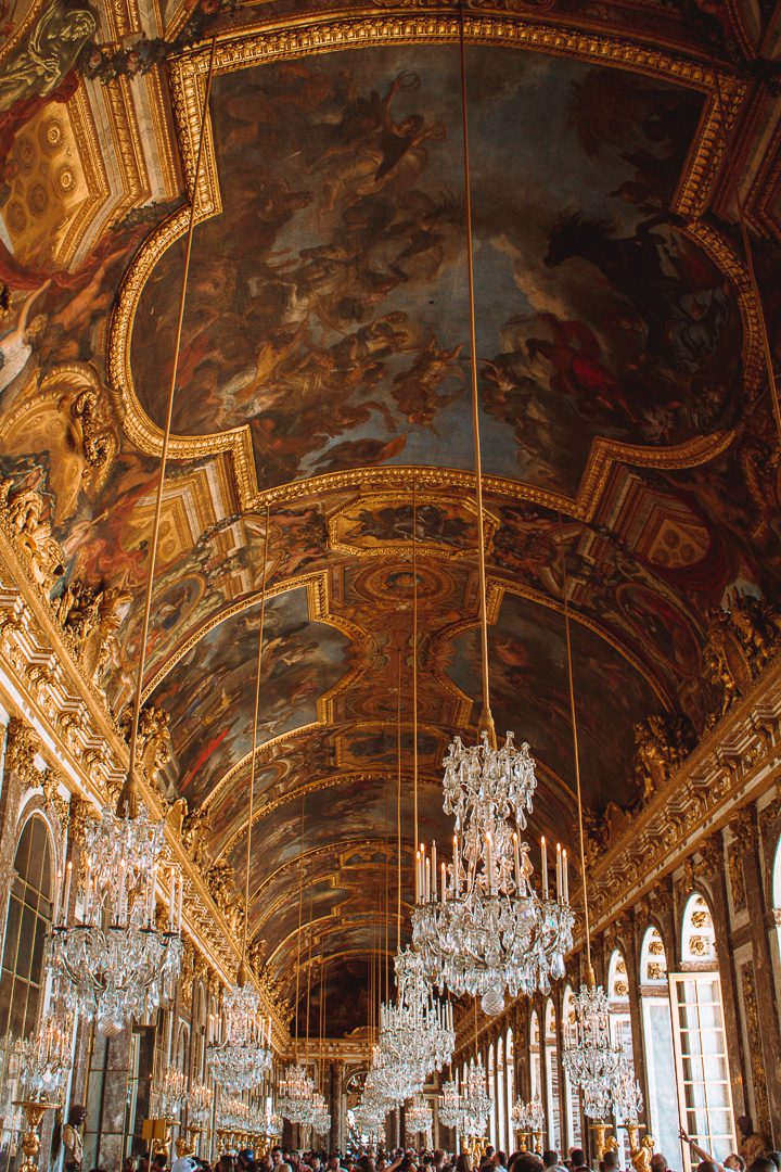 The elegant Hall of Mirrors at Versailles is a must-see destination for people visiting Paris