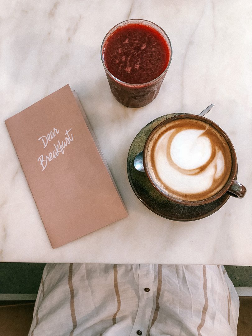 A coffee and fresh pressed juice at Dear Breakfast in Lisbon 