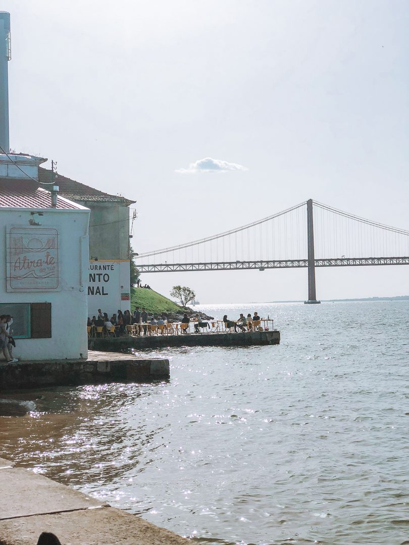 Ponto Final patio looking out towards the Ponte 25 de Abril bridge and the tranquil waterfront.