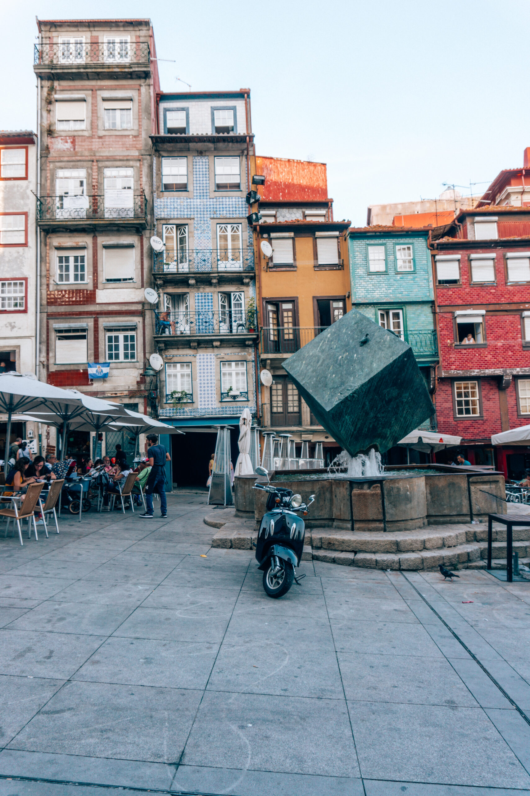 The charming square, and colourful tiled apartment buildings in Ribeira, historic centre of Porto, Portugal.