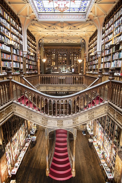 The enchanting interiors of the famous Livraria Lello bookshop in Porto, Portugal, with it's grand wooden staircase and stained glass window ceiling
