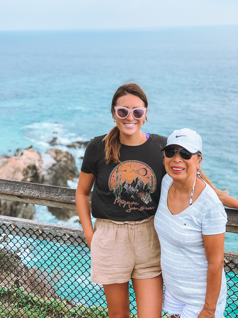 A girl and her mom hike around the Byron Bay lighthouse