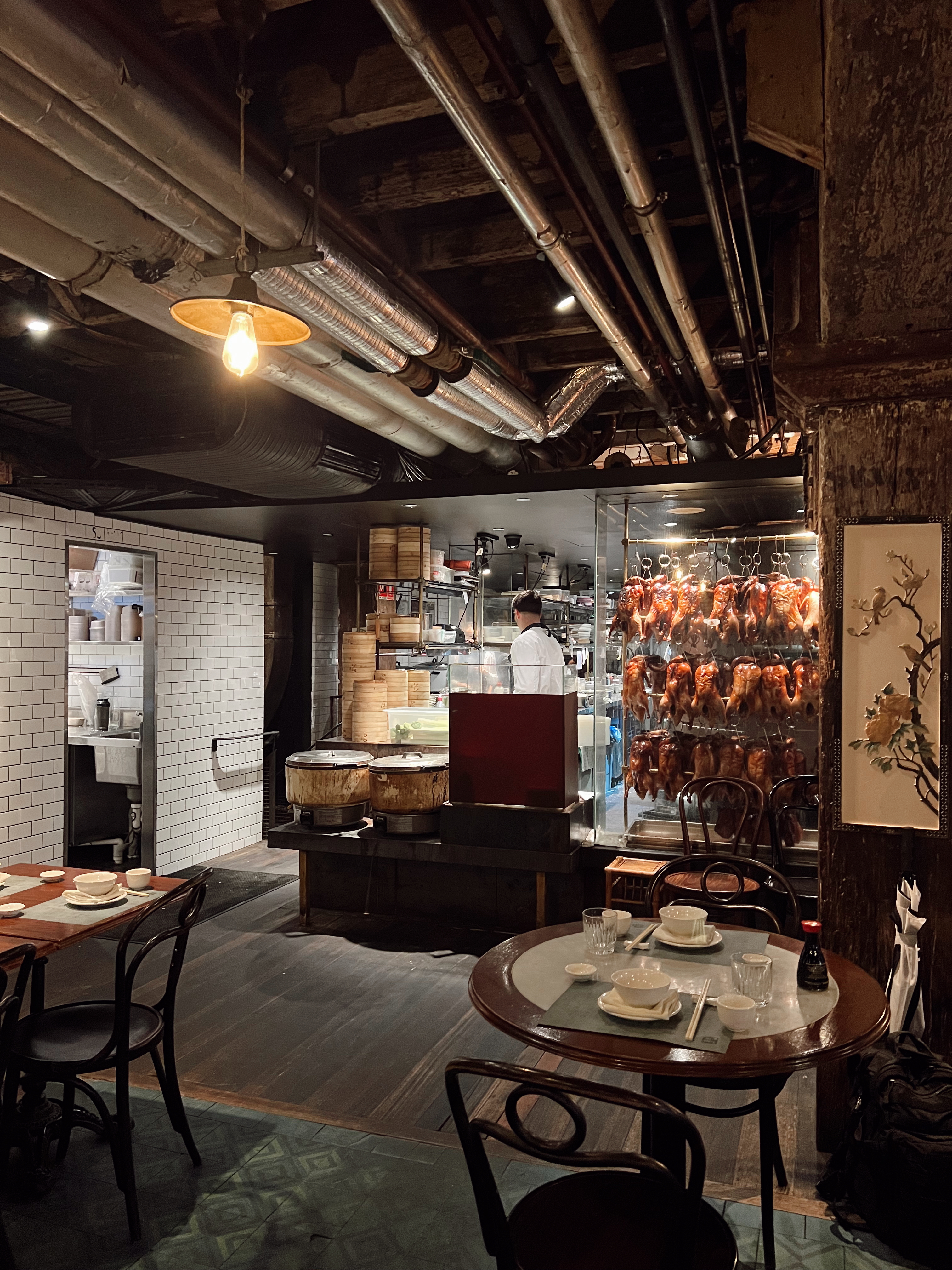 Peaking Ducks and a chef works in the kitchen of Mr. Wong’s restaurant - awesome for lunch or dinner in Sydney