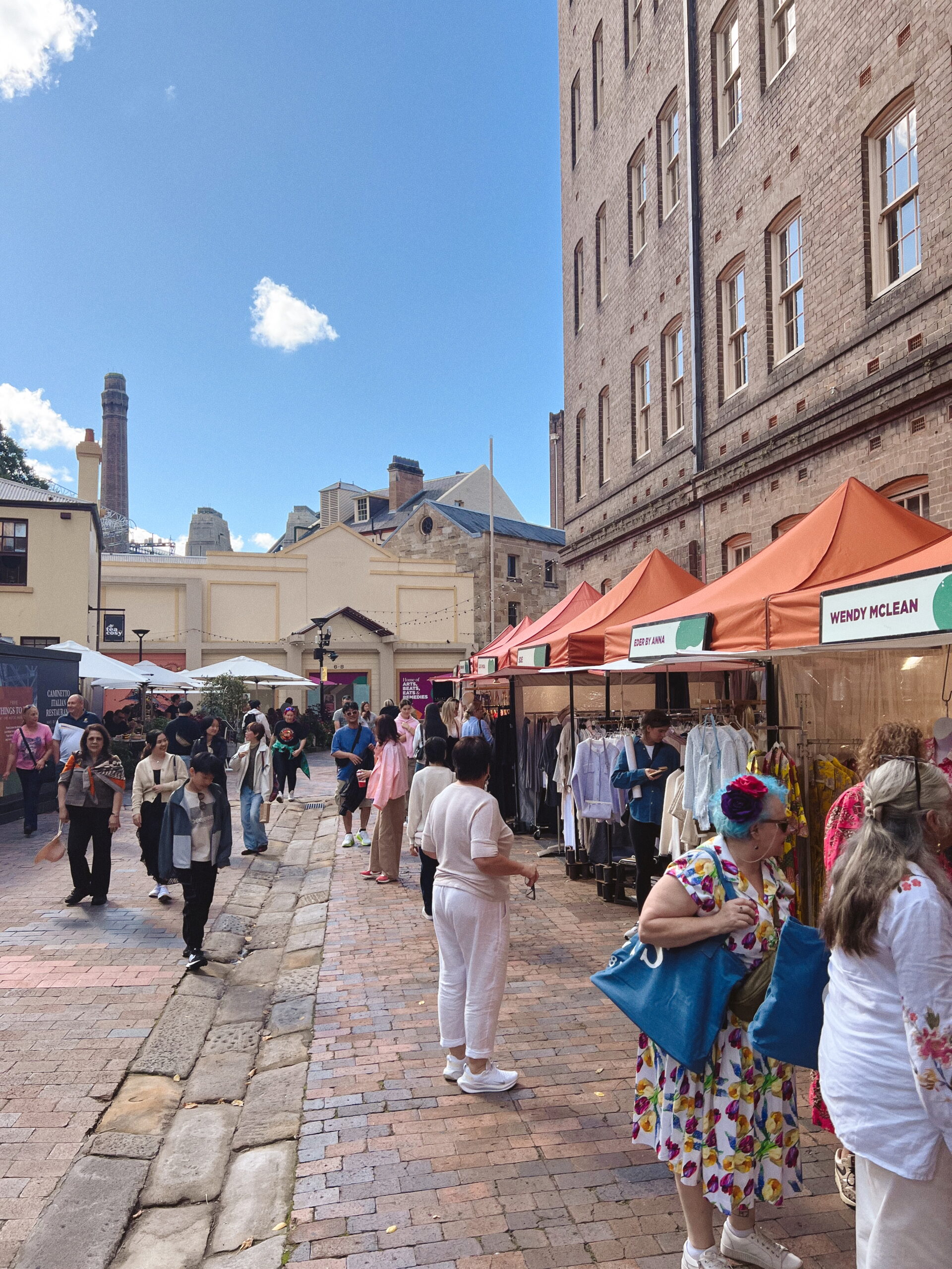 Shoppers explore artisan stalls the Rock's during the Saturday and Sunday market - a free thing to do while visiting Sydney