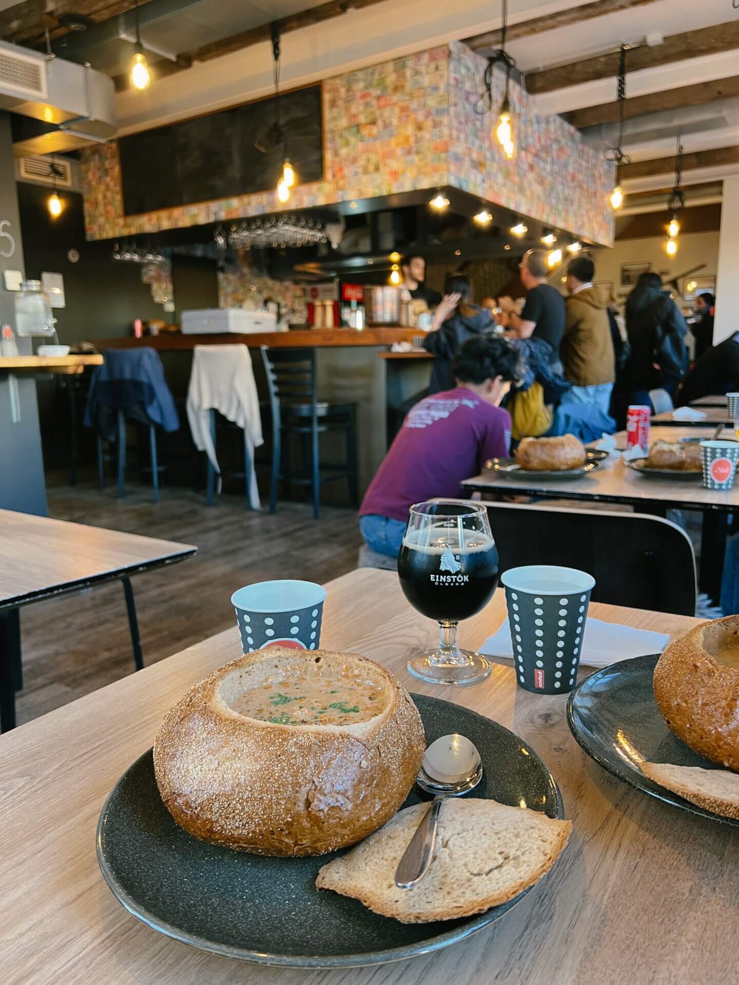 Seafood stew in a bread bowl and Iceland beer at Icelandic Street Food Restaurant in Reykjavik